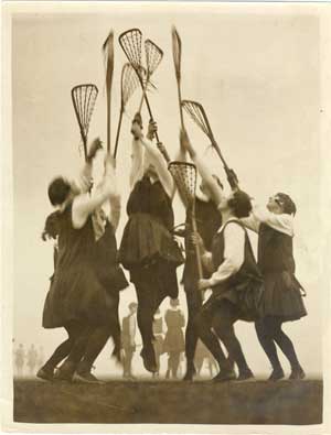 Young women playing lacrosse